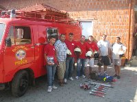 Copy of gasilci pred vozilom in prvo opremo.jpg